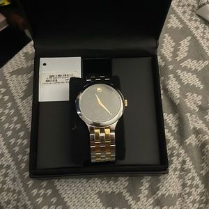 Movado watch silver with black face worm a few times condition 7/10
